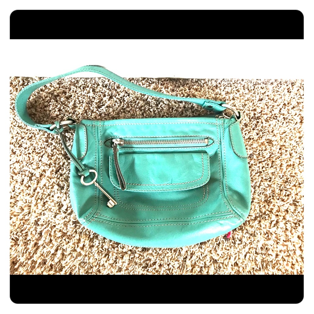 Teal Fossil leather purse.